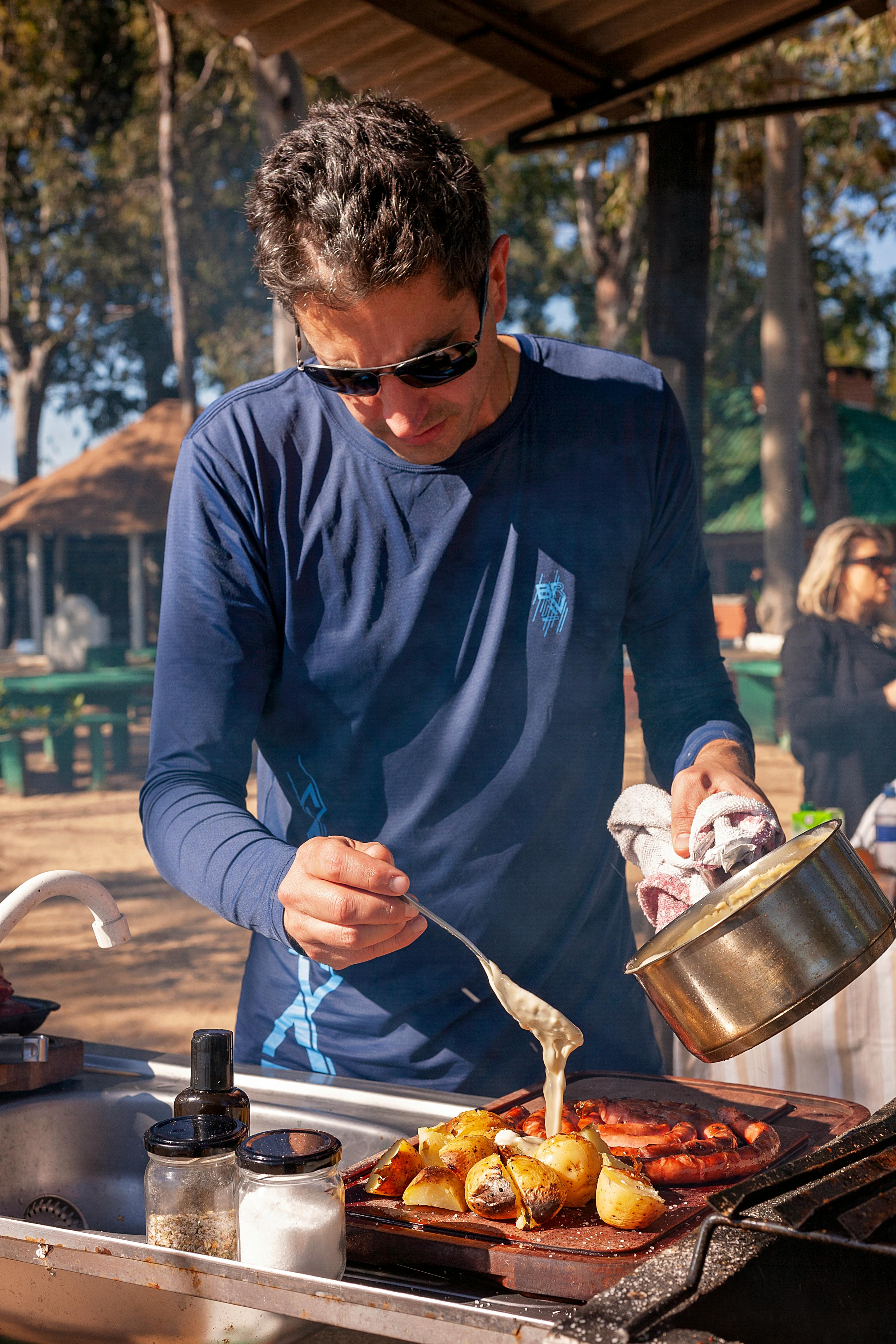 man cooking food on grill on barbecue dinner