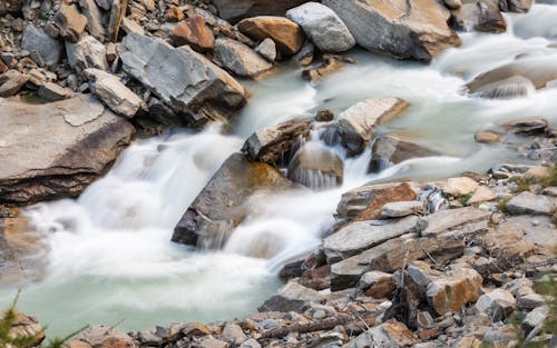 Rocks on Small Waterfall on Stream