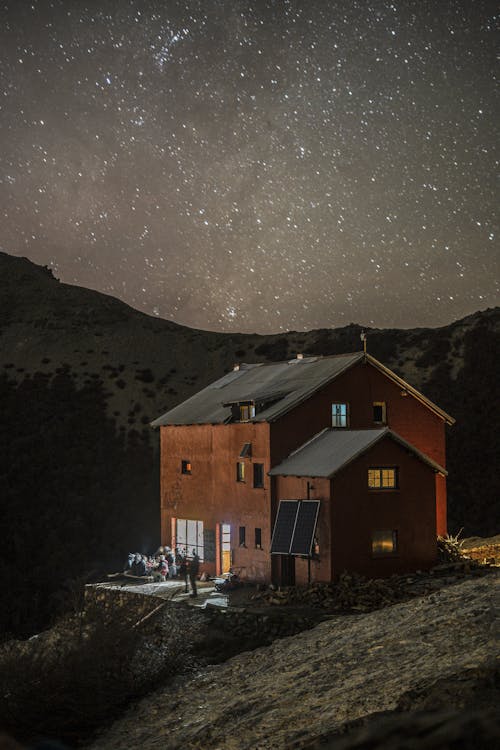 Stars on Clear, Night Sky over Buildings in Countryside