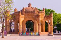 Historic La Pila Fountain in Chiapa de Corzo, Mexico, showcasing intricate brick architecture under a bright sky.