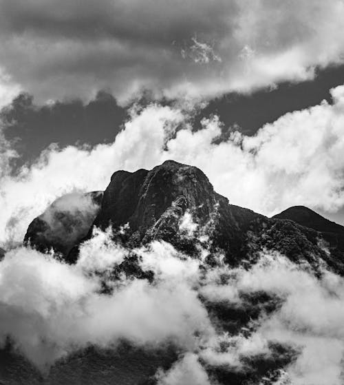 Scenic View of a Mountain Peak Shrouded in Clouds