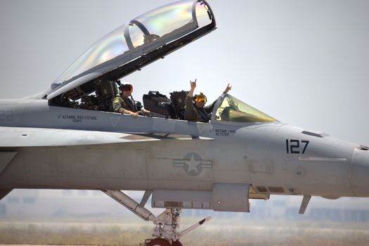 Military Pilots in the cockpit of an American Fighter Jet