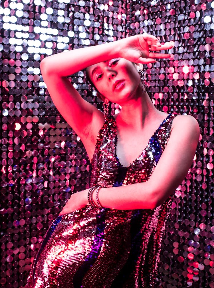 Woman In Glitter Dress Dancing In Disco Studio