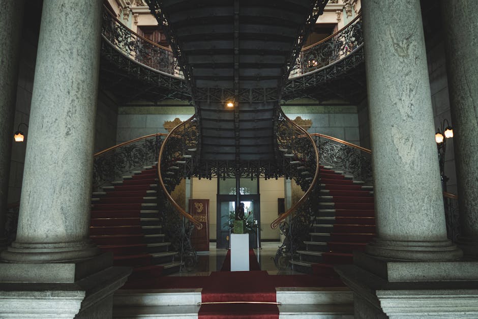 Grand staircase with ornate design in historic government building, Belo Horizonte.