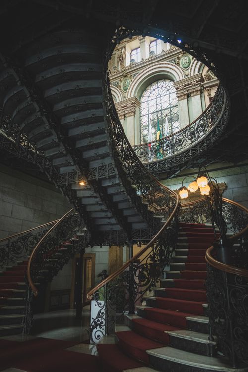 Free Elegant spiral staircase with ornate details in a historic building in Belo Horizonte, Brazil. Stock Photo