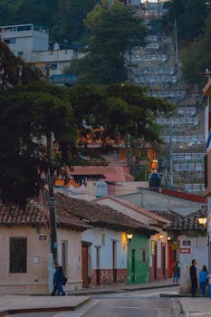 Picturesque view of colorful houses on a street in San Cristóbal de las Casas, Mexico.