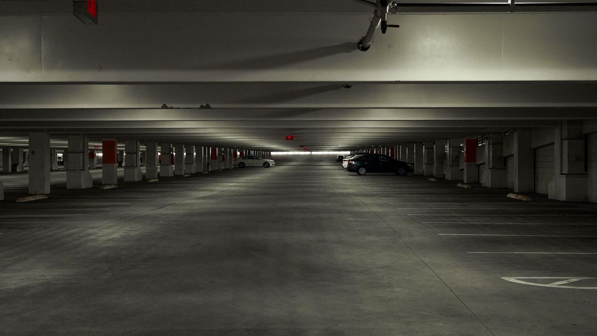 An almost empty multi-storey car park with low concrete ceilings, the problem accommodation in Gloucester with parking avoids