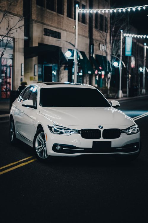 A White BMW on the Street at Night · Free Stock Photo