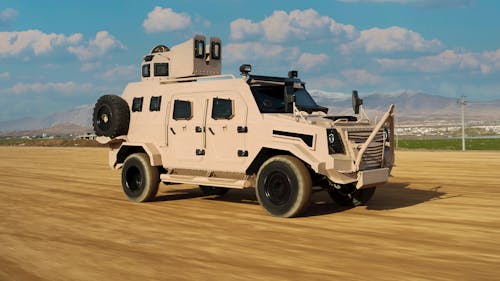 A Brown Military Vehicle Driving on a Dirt Road 
