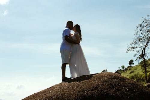 Couple Standing on the Hill and Kissing