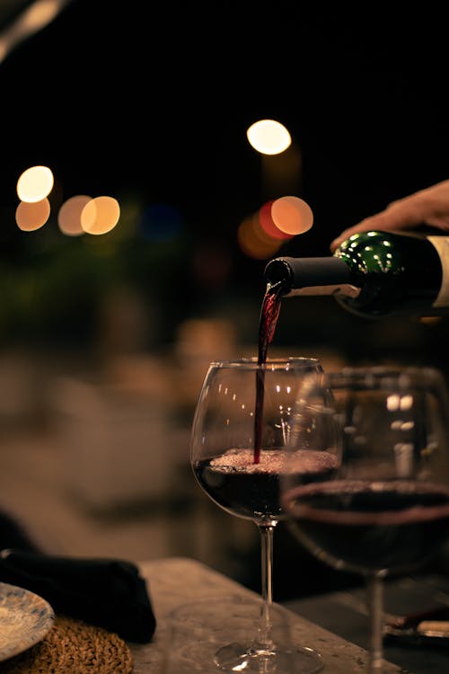 Close-up of Red Wine Poured into a Wineglass 