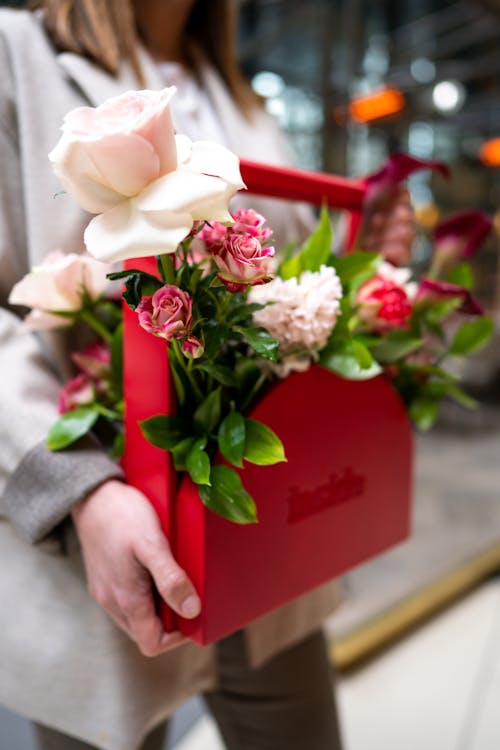 Close-up of Woman Holding a Box with Flowers 