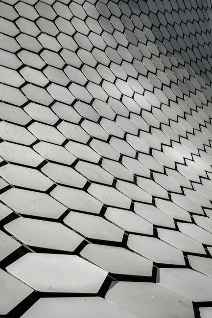 Geometric pattern of Museo Soumaya's hexagonal facade in Mexico City.