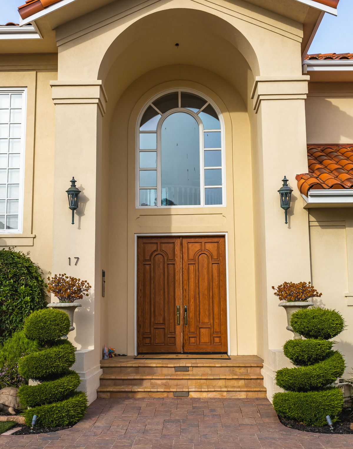 Stately entrance with double wooden doors