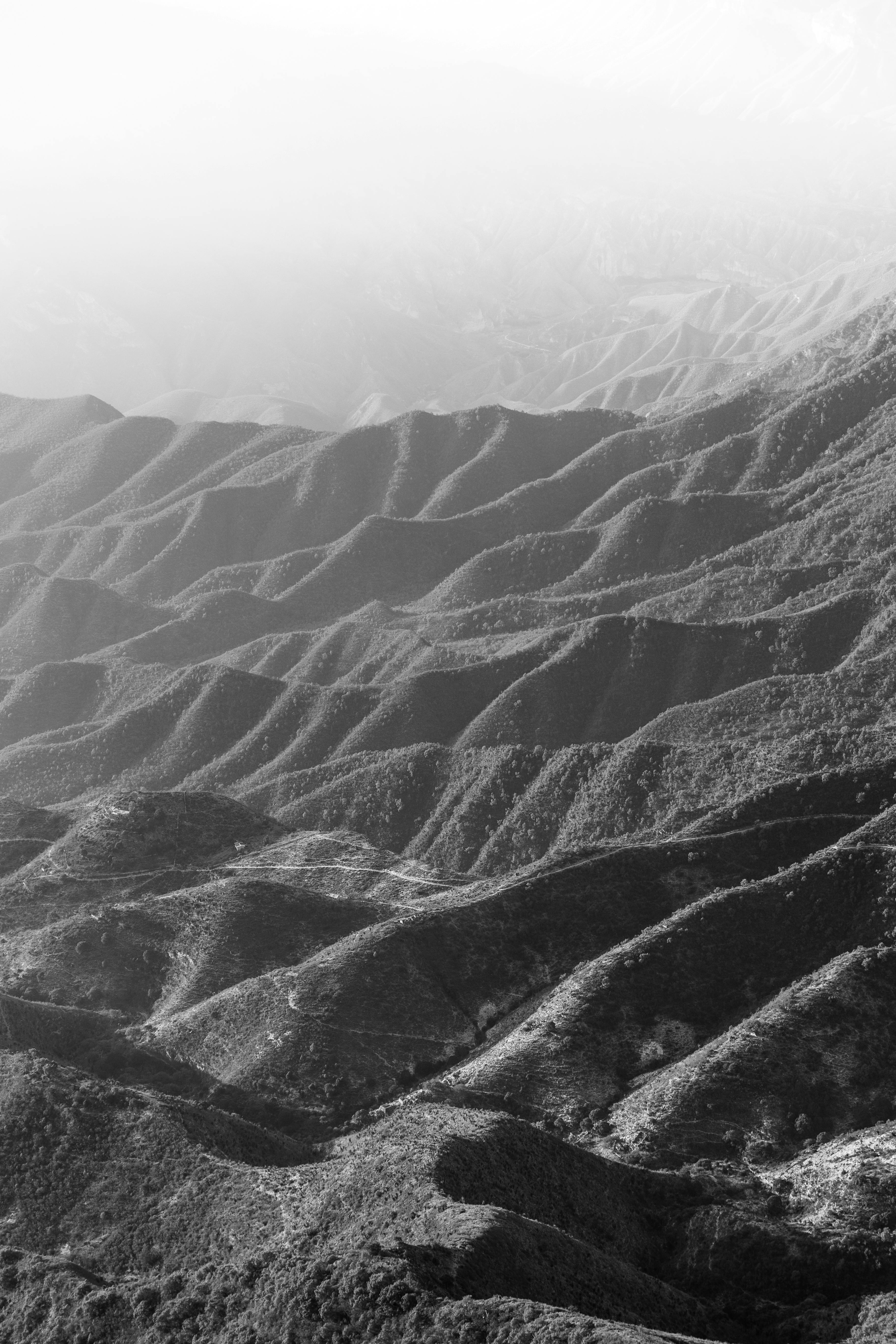 Aerial view of dramatic black and white mountain ridges showcasing natural beauty.