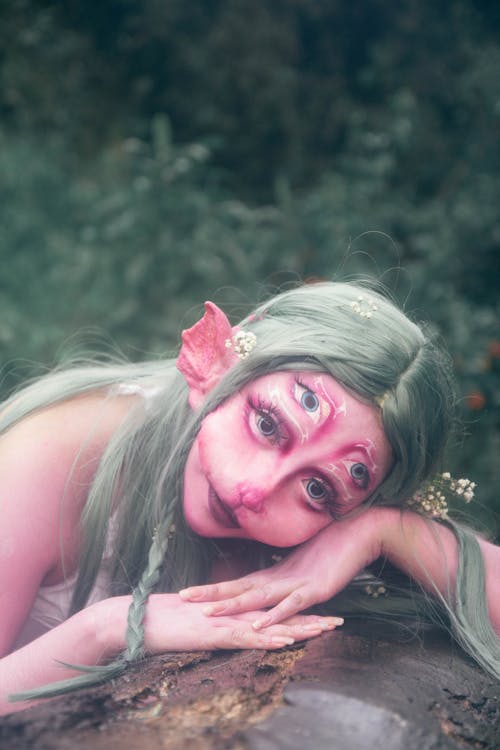 Green-haired Water Nymph Lying on a Rock