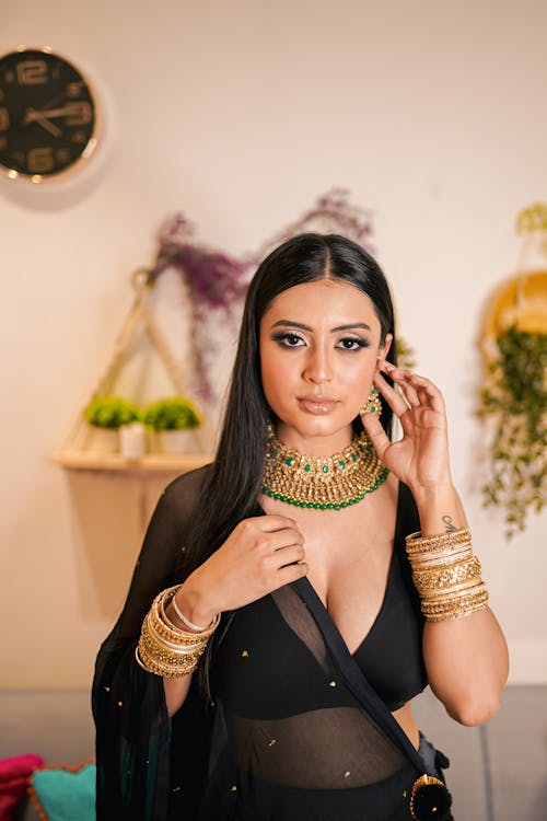 Young Woman Wearing Gold Jewelry 
