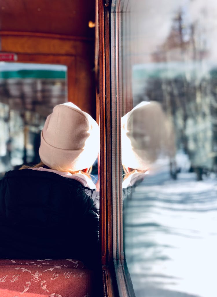 Person Leaning On A Glass Window
