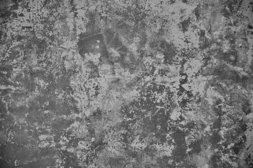 Free Close-up of a textured concrete wall with a distressed surface, perfect for backgrounds. Stock Photo