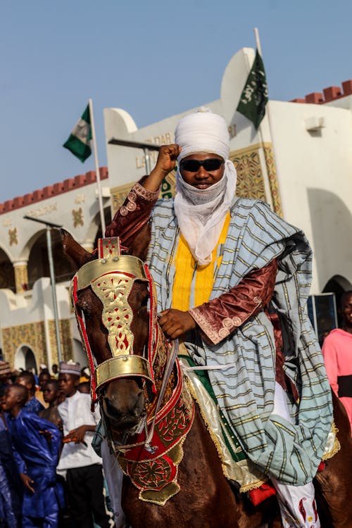Man Riding Horse In Traditional Clothing Free Stock Photo man-riding-horse-in-traditional-clothing-free-stock-photo