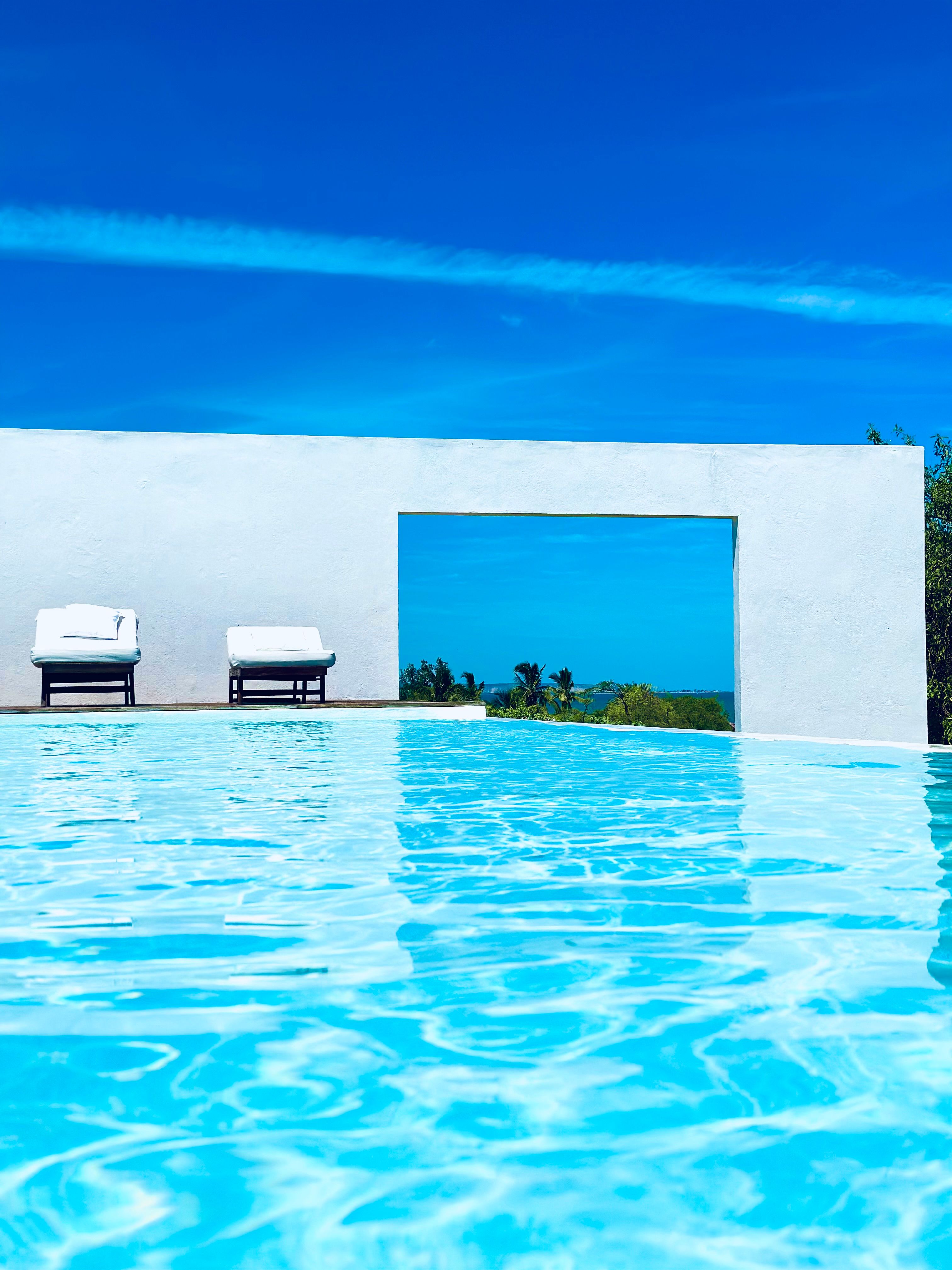 Sunlit Swimming Pool under Clear Sky · Free Stock Photo