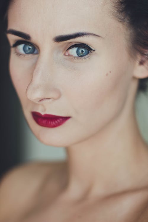 Free Woman Wearing Black Mascara and Red Lipstick Stock Photo