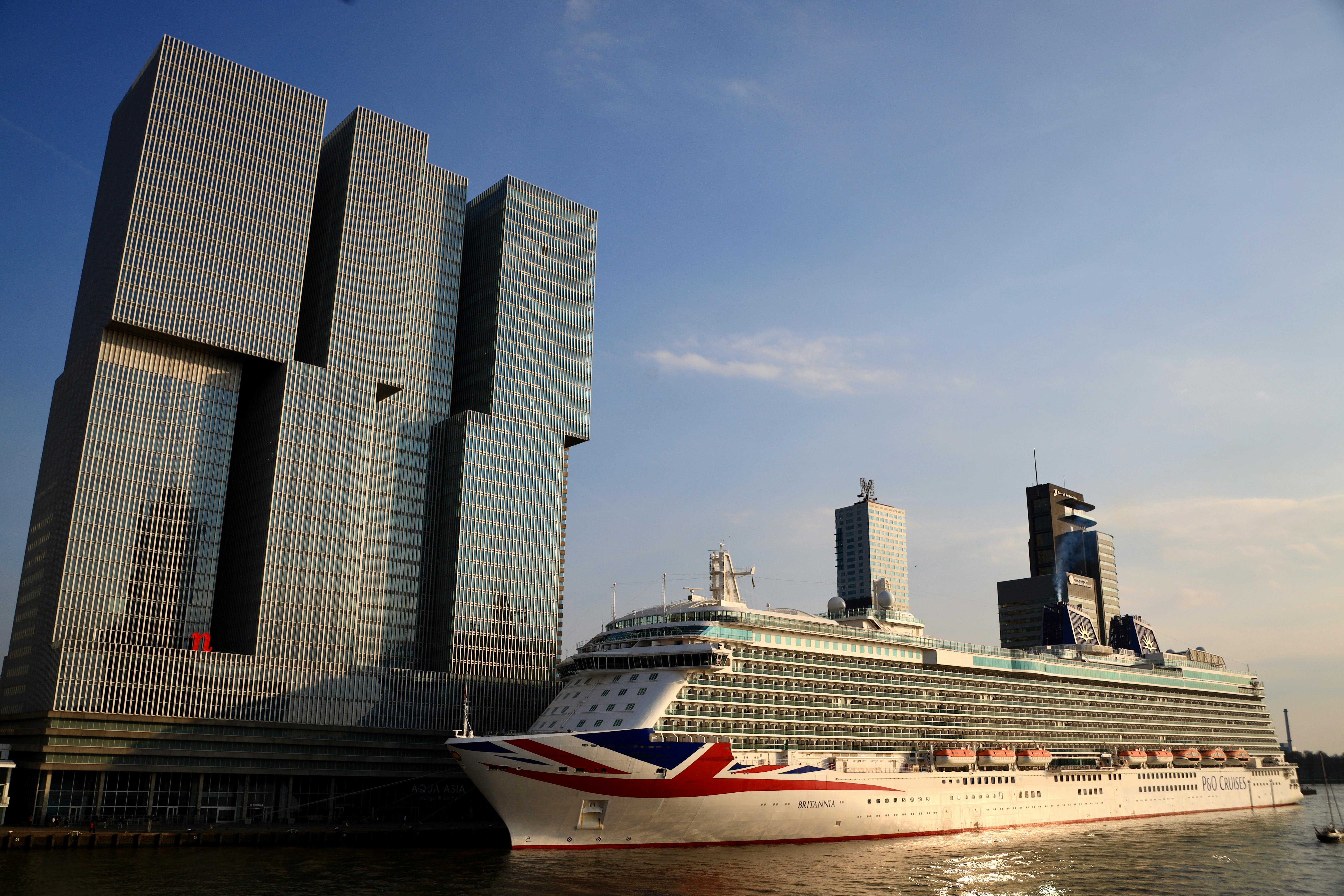 cruise ship by de rotterdam modern building