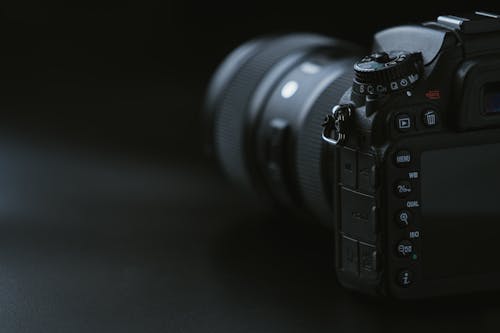 Free Camera On Black Surface Stock Photo