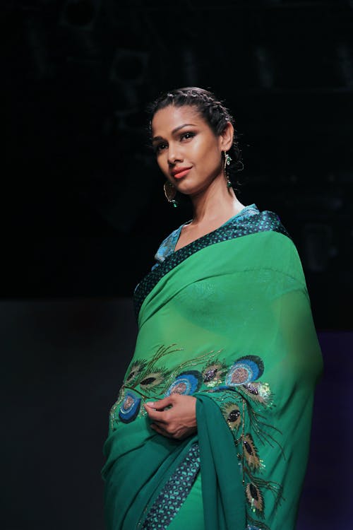 Woman Wearing Green Dress and Earrings