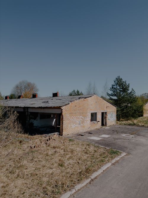 Free Explore the serene solitude of an abandoned brick structure under a clear blue sky in Zaķumuiža, Latvia. Stock Photo