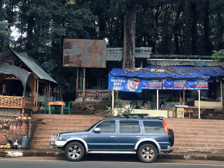 Blue SUV Near Stairs