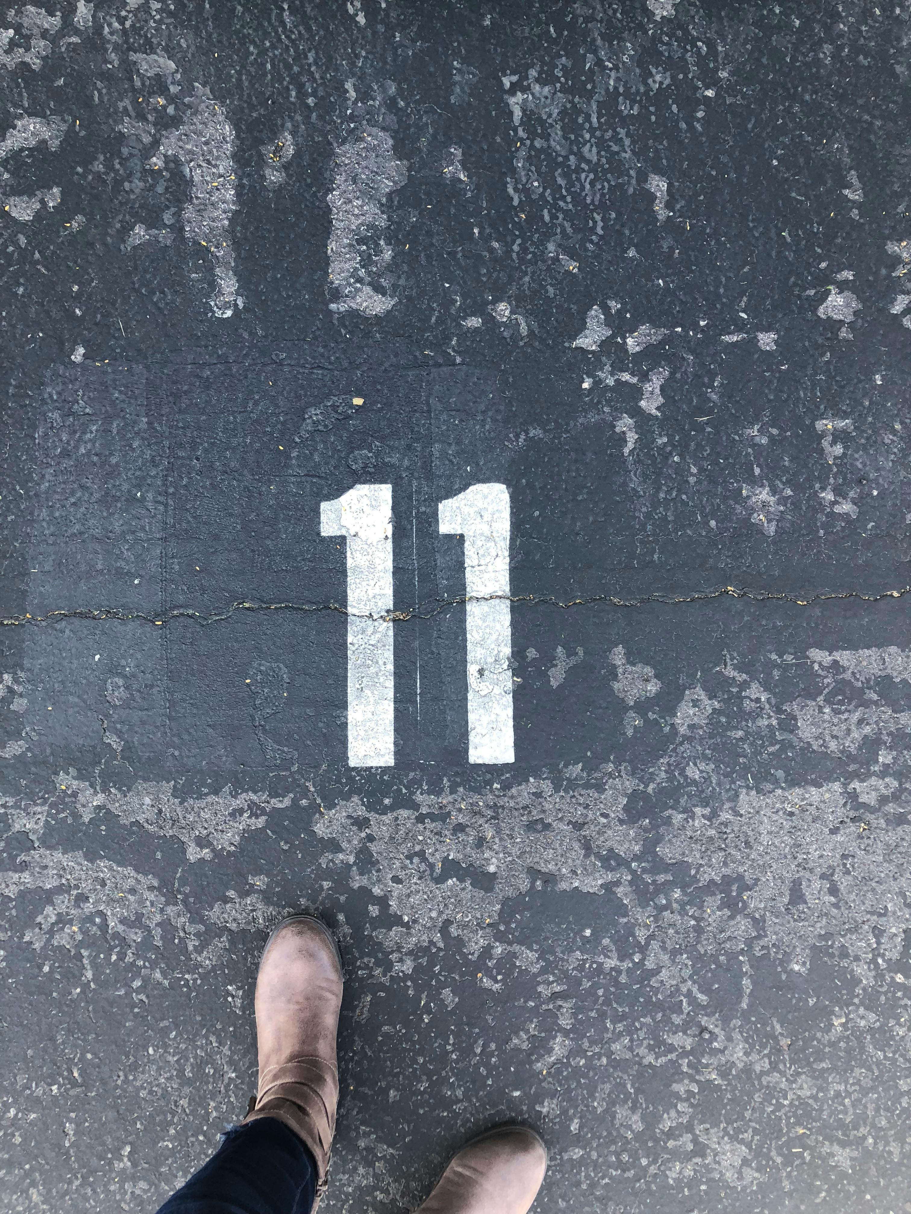 person standing on concrete floor with number