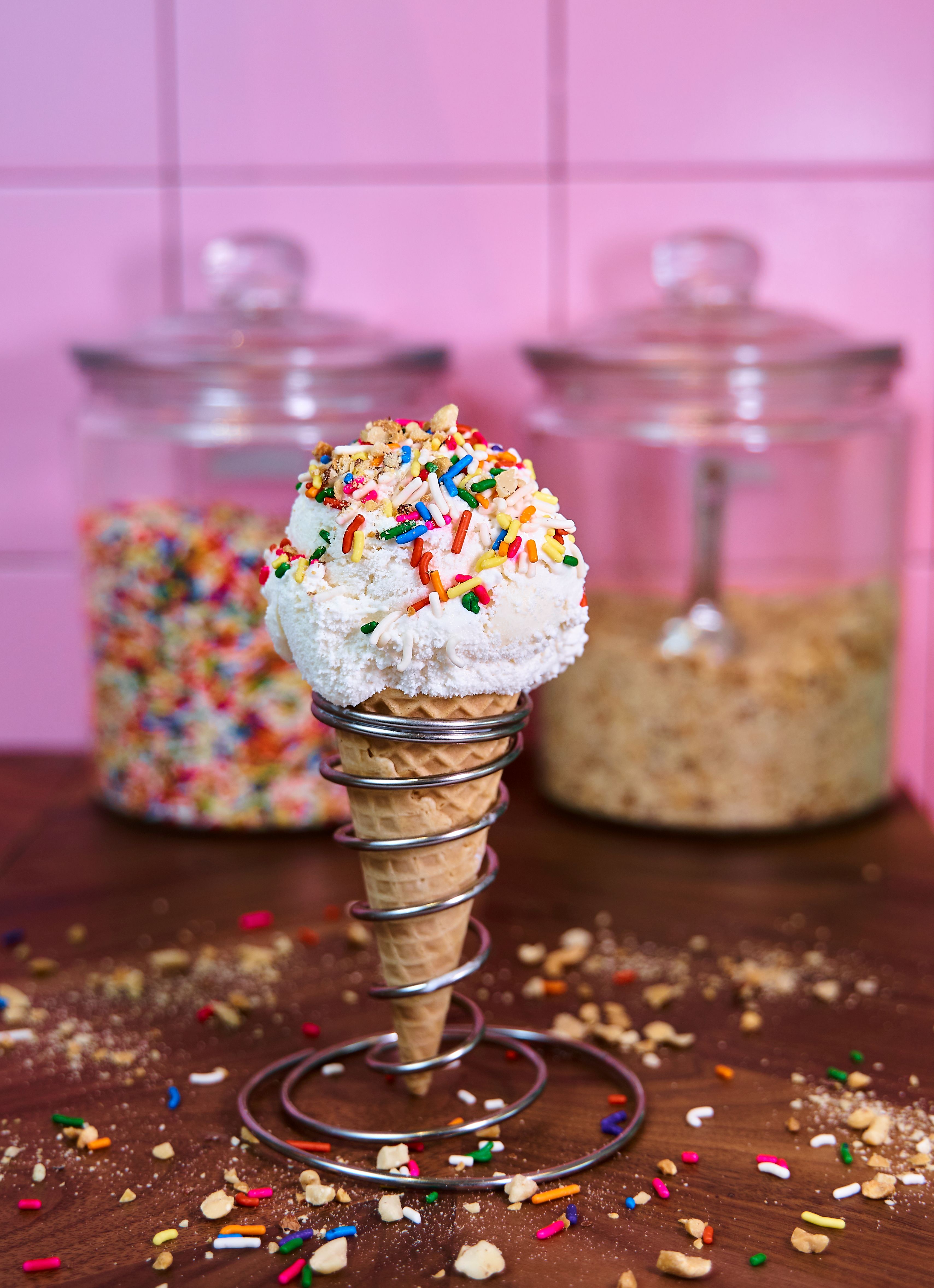 A cone of ice cream with sprinkles on top · Free Stock Photo