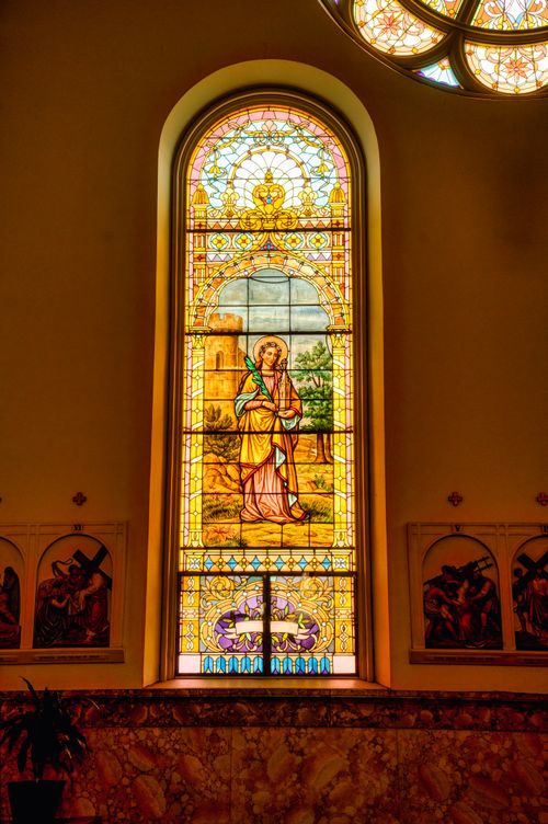 Free Vibrant stained glass window depicting a religious scene in a Winona church. Stock Photo