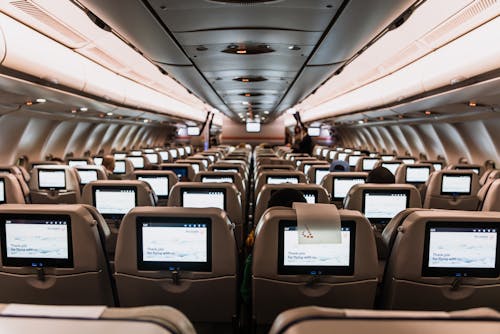Free Seats with Screens in Airplane Stock Photo