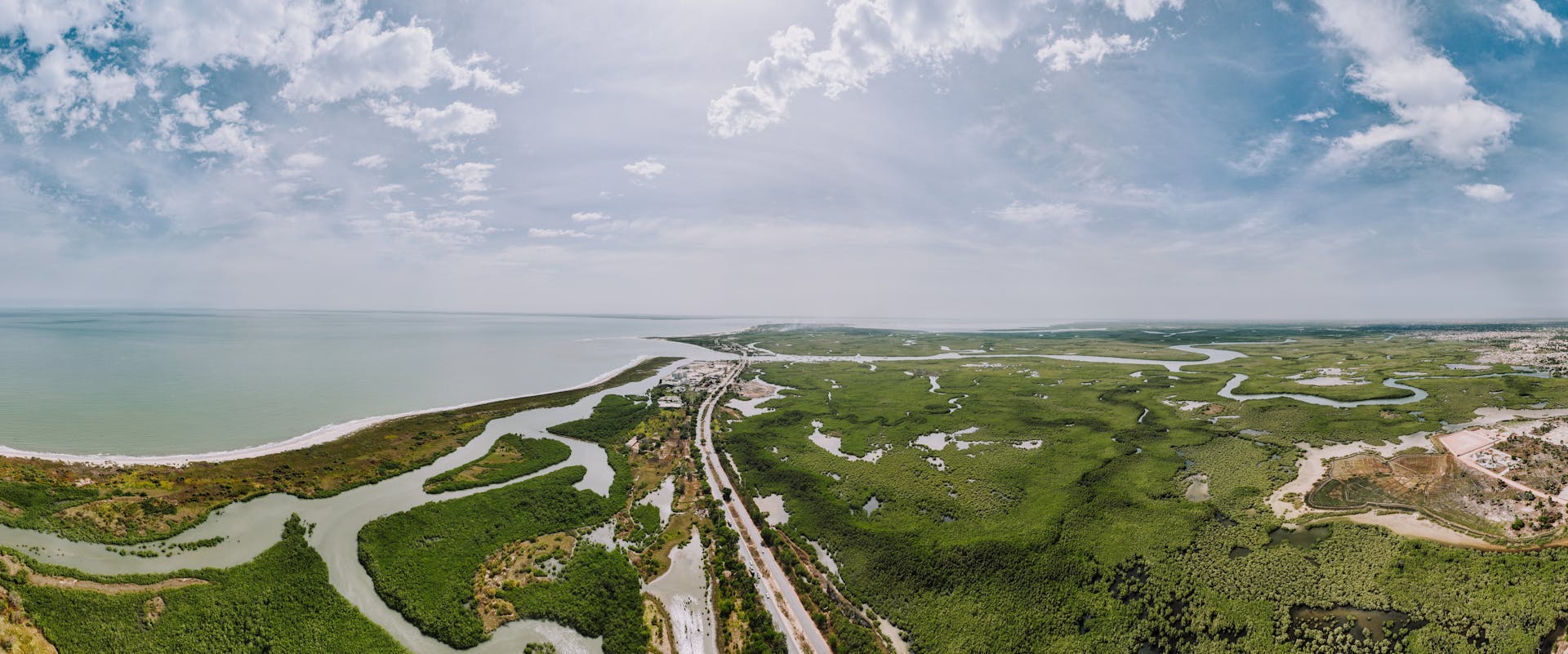 A breathtaking aerial view of a lush coastal landscape with winding waterways and vibrant greenery.