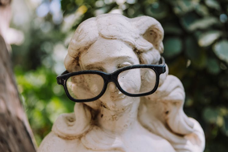 Eyeglasses On Marble Sculpture Head