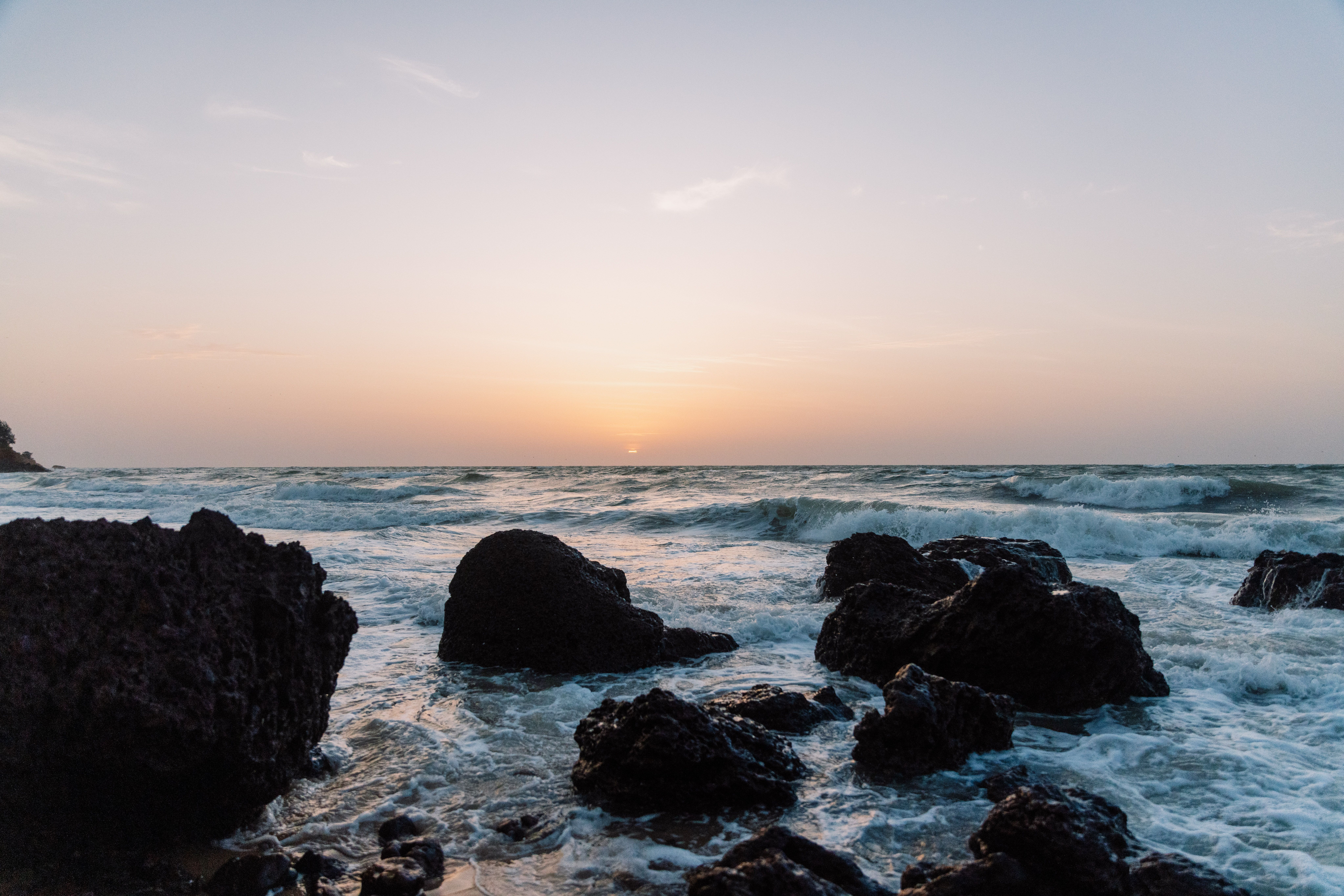 Ocean crashing on rocks at the coast, Senegal
