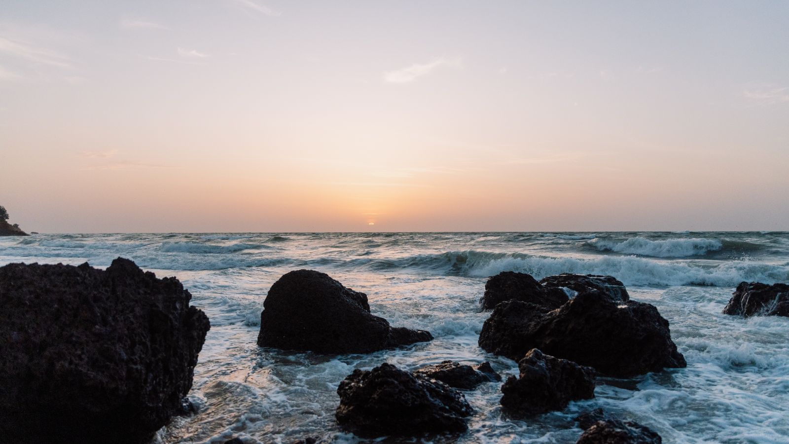 Ocean crashing on rocks at the coast, Senegal