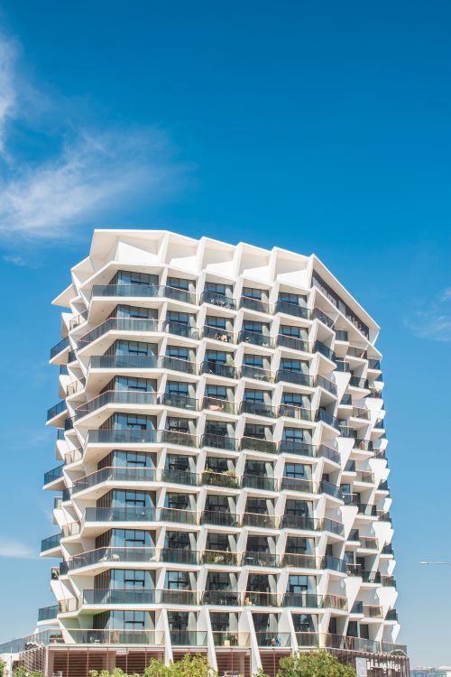 Free Stunning contemporary apartment building with unique design in Dubai's skyline. Stock Photo