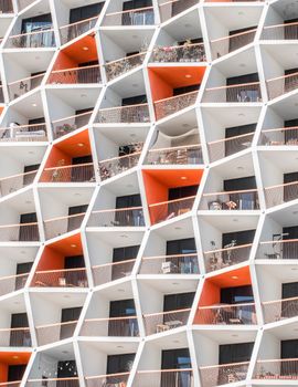 Contemporary apartment complex with geometric facade in Dubai, UAE.