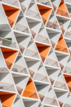 Dynamic view of geometric apartment balconies in Dubai with vibrant colors.