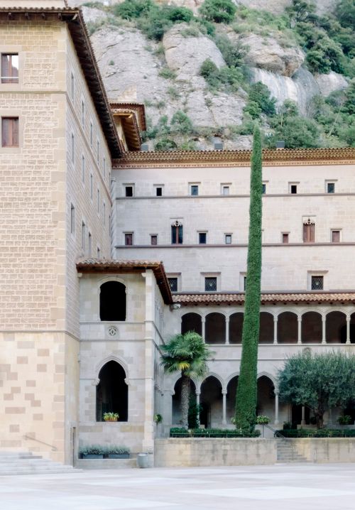 Free Scenic view of the Santa Maria de Montserrat Abbey with surrounding mountains, Catalonia. Stock Photo