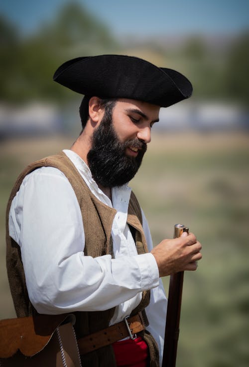 Man in Hat Standing with Musket