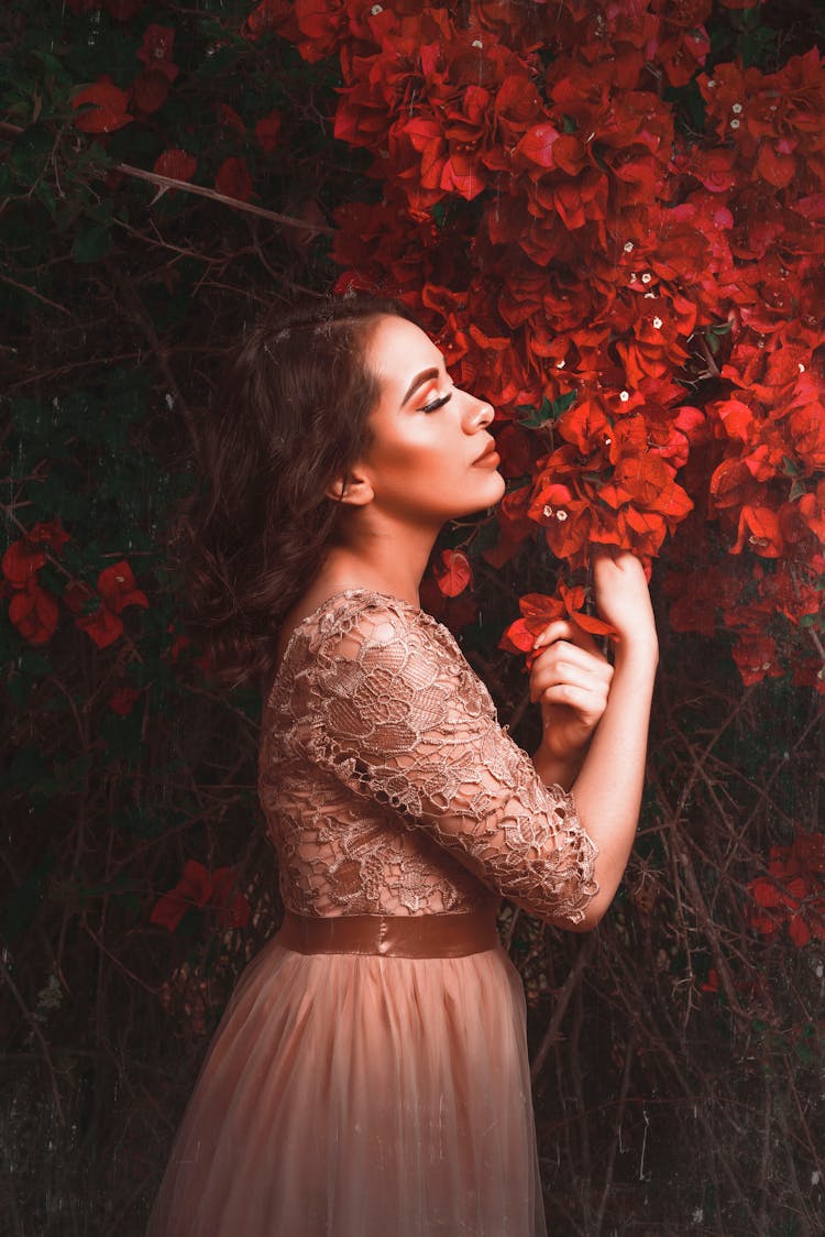 Woman Sniffing Flowers