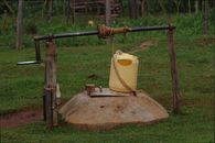 Rustic well with a yellow container in rural Kitale, Kenya.