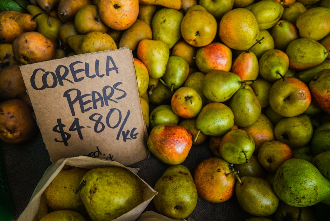 Free Green-and-orange Corella Pear Fruit Lot Stock Photo
