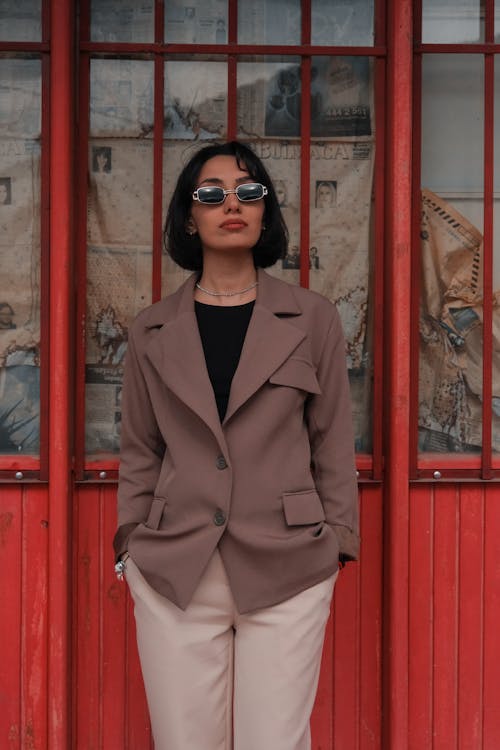 Woman Posing in Sunglasses and Suit