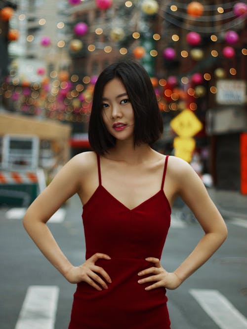 Woman in Red Dress Posing on Street