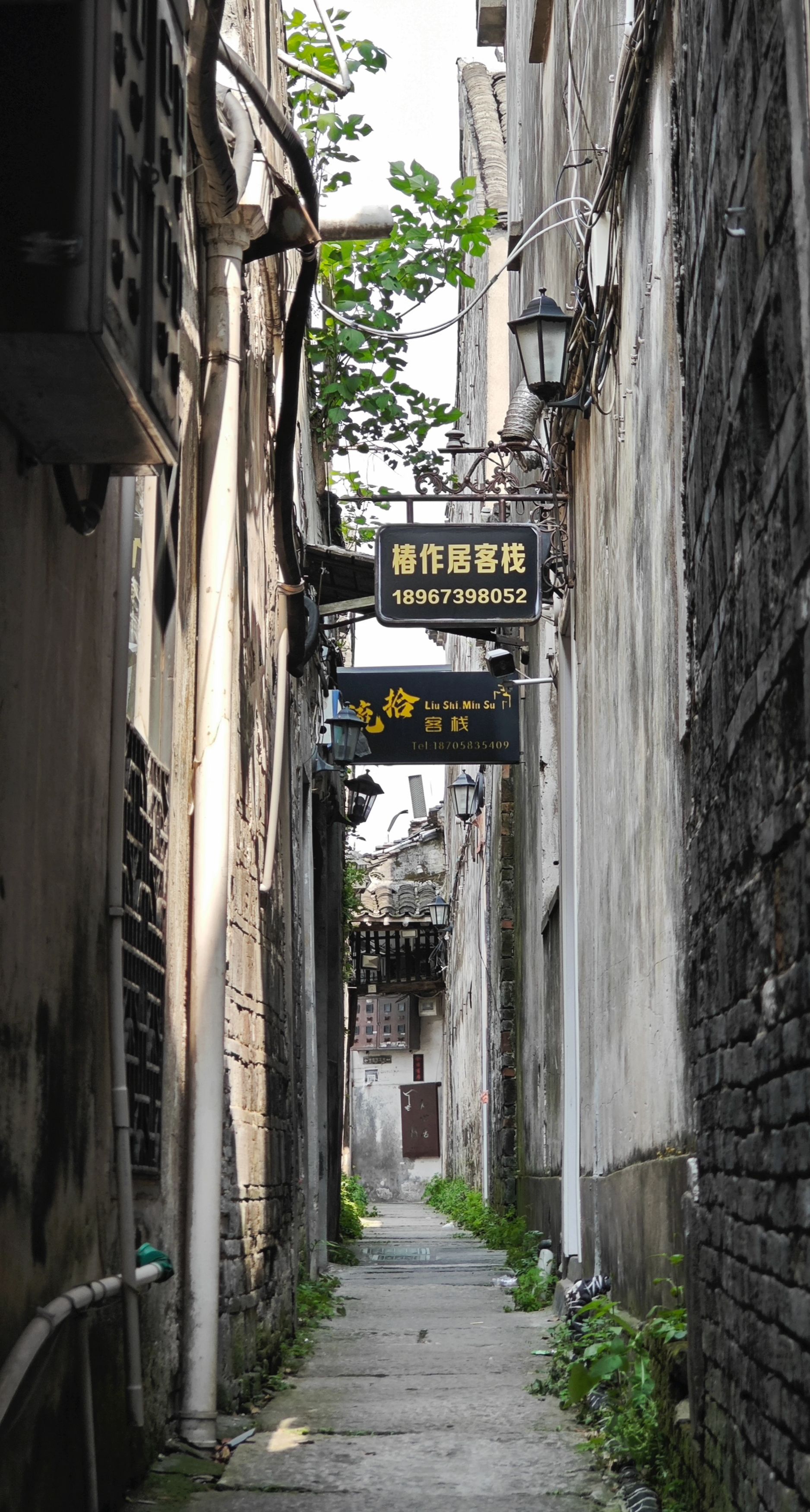Explore a charming narrow alleyway in Jia Xing Shi, showcasing traditional architecture and urban charm.